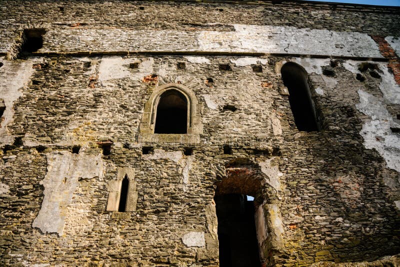 Medieval gothic castle Bezdez, royal palace, grey stone ruin on hill at sunny day, ancient fortress, fairytale stronghold, arched