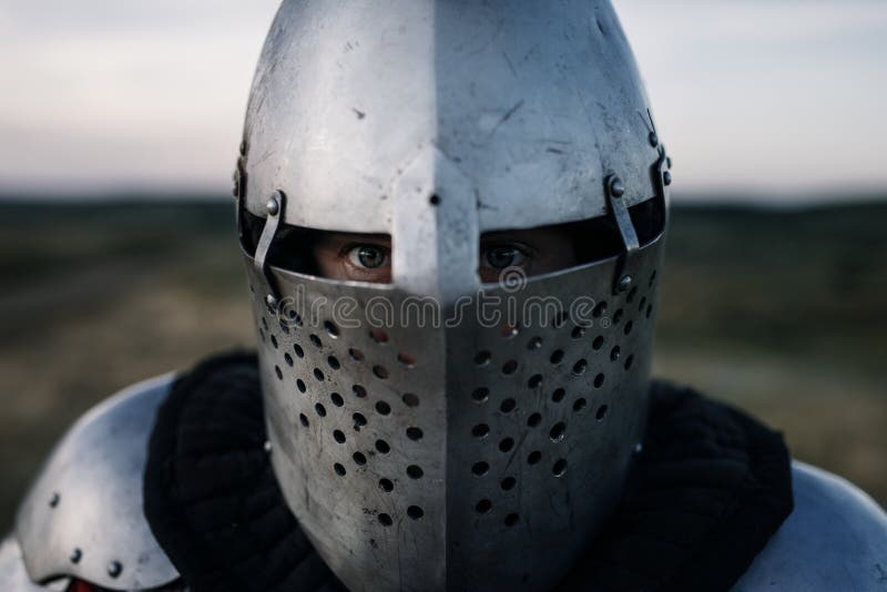 Medieval knight in armor and helmet closeup view stock photos Medieval knight in armor and helmet closeup view stock photos
