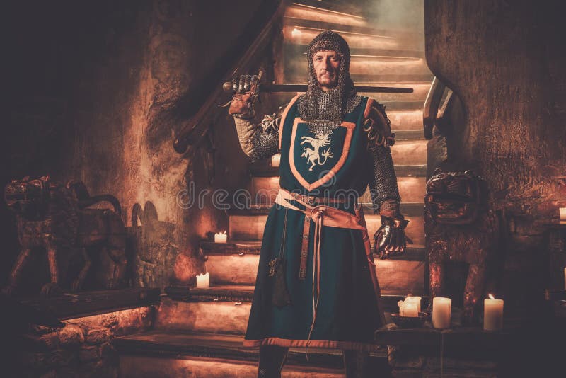 Medieval knight on guard in ancient castle interior. royalty free stock photo Medieval knight on guard in ancient castle interior. royalty free stock photo