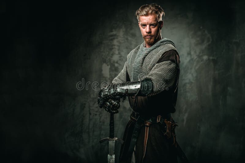 Medieval knight with sword and armour royalty free stock photo Medieval knight with sword and armour royalty free stock photo