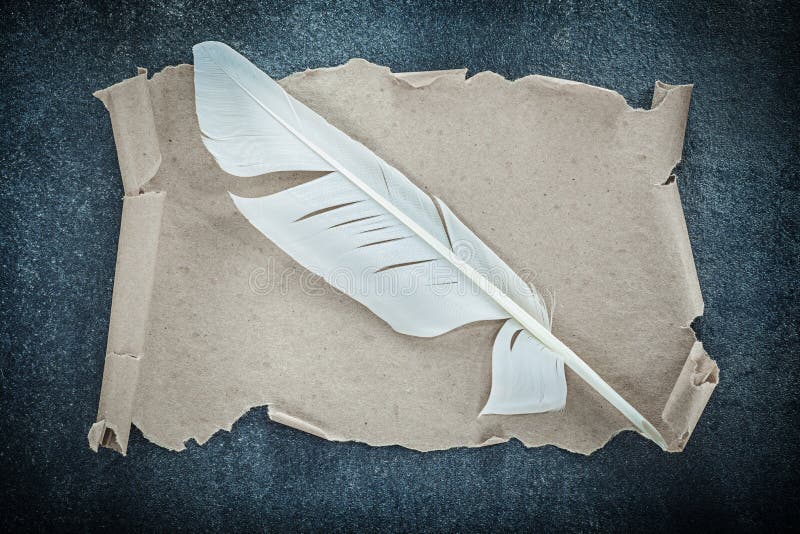 Medieval paper scroll quill on black background royalty free stock image