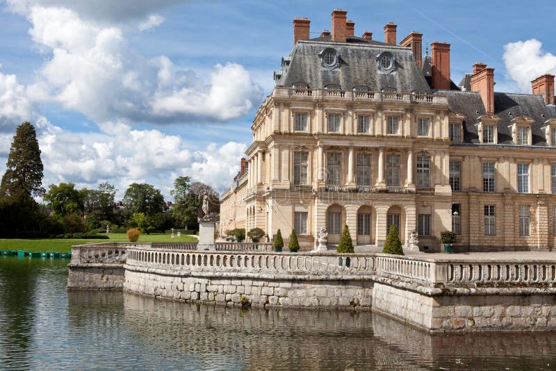 Medieval royal castle Fontainbleau and lake