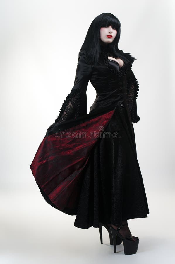 Medieval vampire girl in black red dress