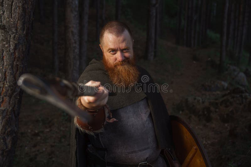 Medieval warrior viking barbarian with ax and shield in forest. Ancient pagan celtic images stock images, royalty-free photos and pictures