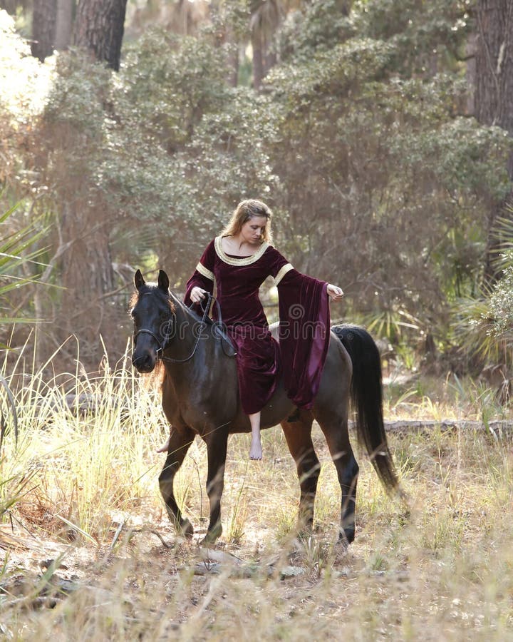 Medieval woman riding horse in forest royalty free stock photos Medieval woman riding horse in forest royalty free stock photos