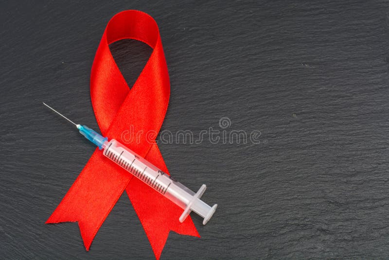Medisch concept, rood lint-symbool van AIDS-Dag, 1 December royalty-vrije stock afbeeldingen Medisch concept, rood lint-symbool van AIDS-Dag, 1 December royalty-vrije stock afbeeldingen