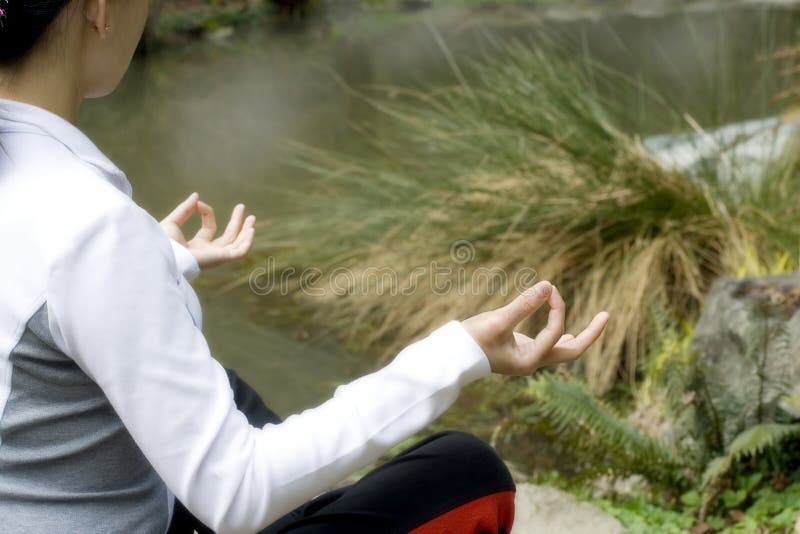 Meditation. Woman relaxing by meditation/yoga stock photos