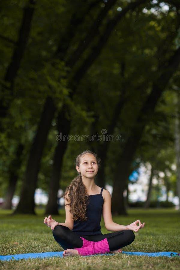 Meditation for children. Teenage yoga royalty free stock photos Meditation for children. Teenage yoga royalty free stock photos