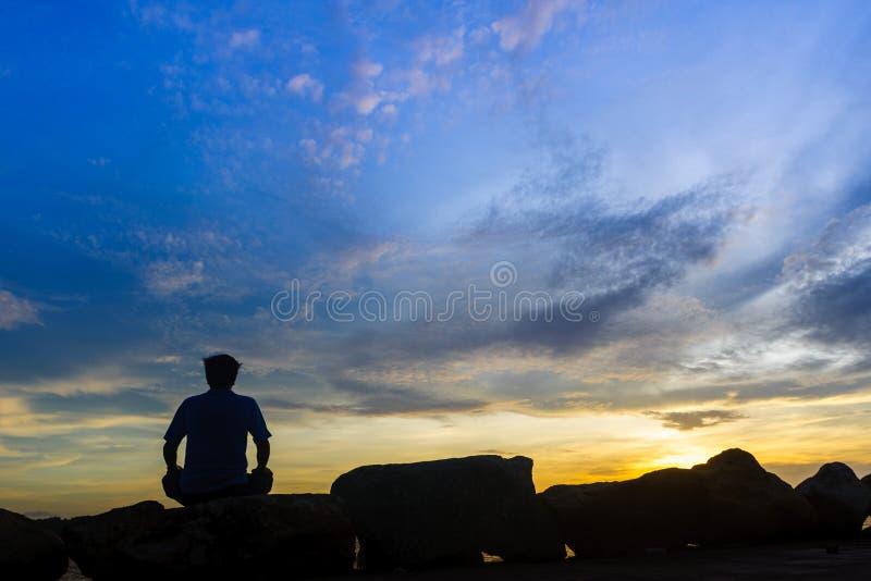 Meditation in the sunset stock image. Image of scenics - 64694527