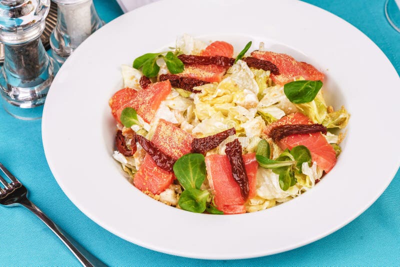 Mediterranean salad. Cabbage, tomatoes, smoked seeds, olives, olives, basil and rosemary, seasoned with olive oil and balsamic sau stock photos