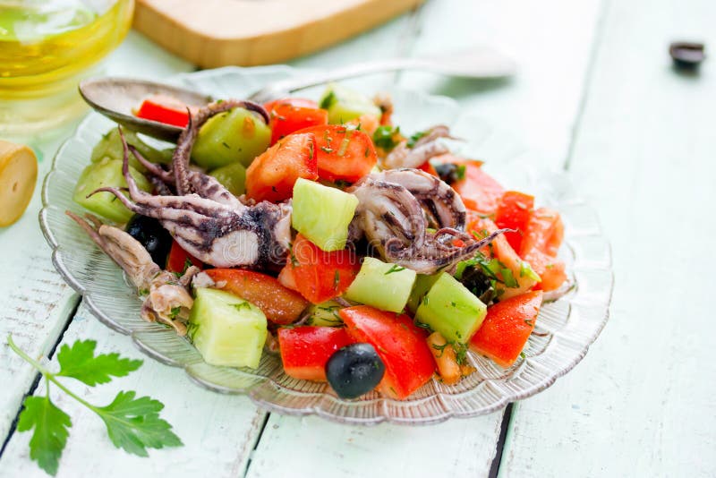 Mediterranean salad with octopus tomatoes cucumber onion