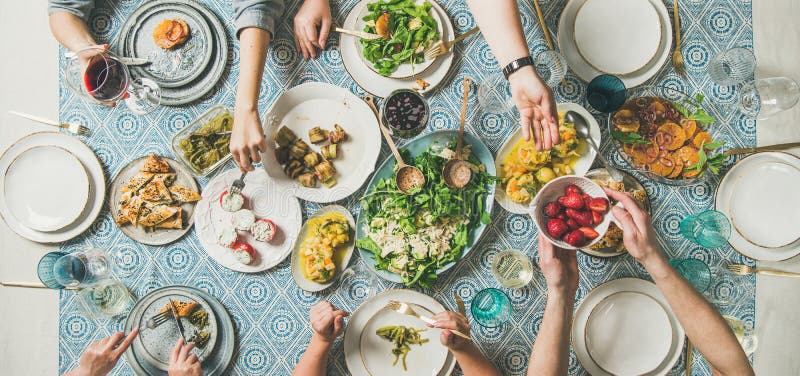 Mediterranean style dinner with various snacks and drinks, wide composition royalty free stock image