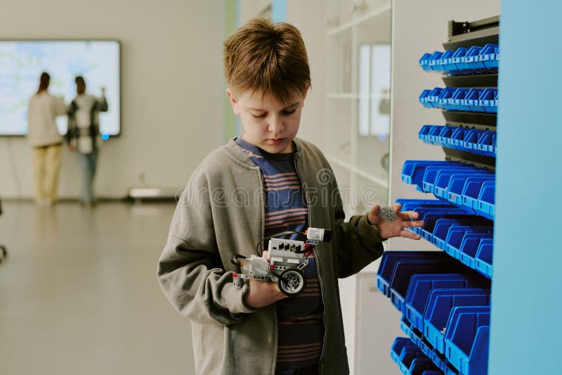 School Boy Looking at Robot royalty free stock images