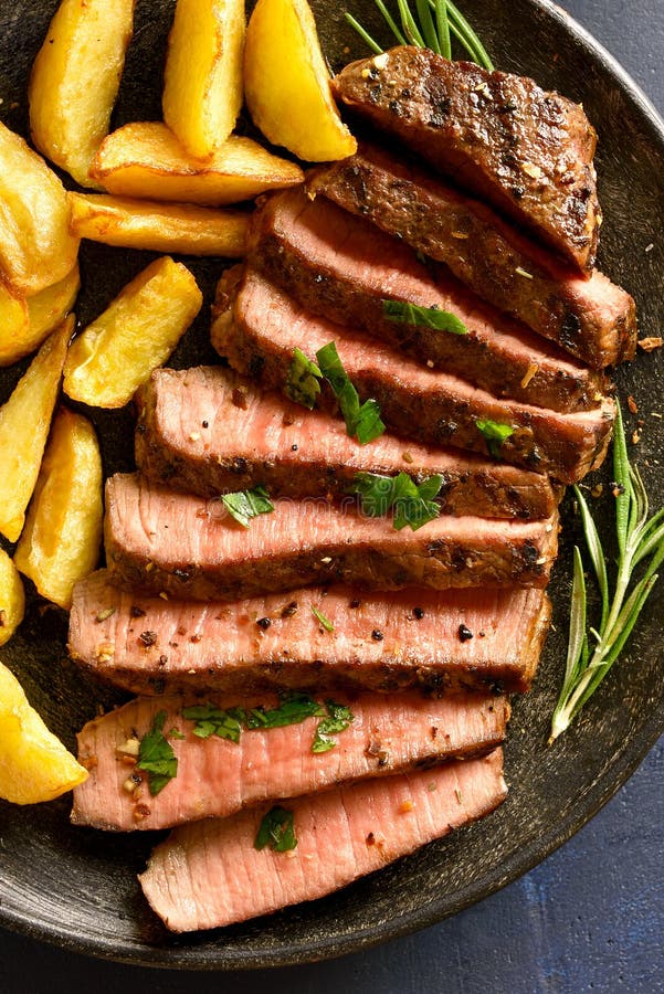 Medium Rare Roast Beef With Potato Wedges Stock Image - Image of fried ...