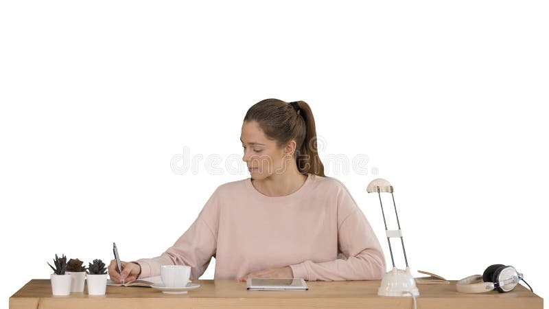Happy student studying and learning taking notes from a digital tablet on white background. royalty free stock photo