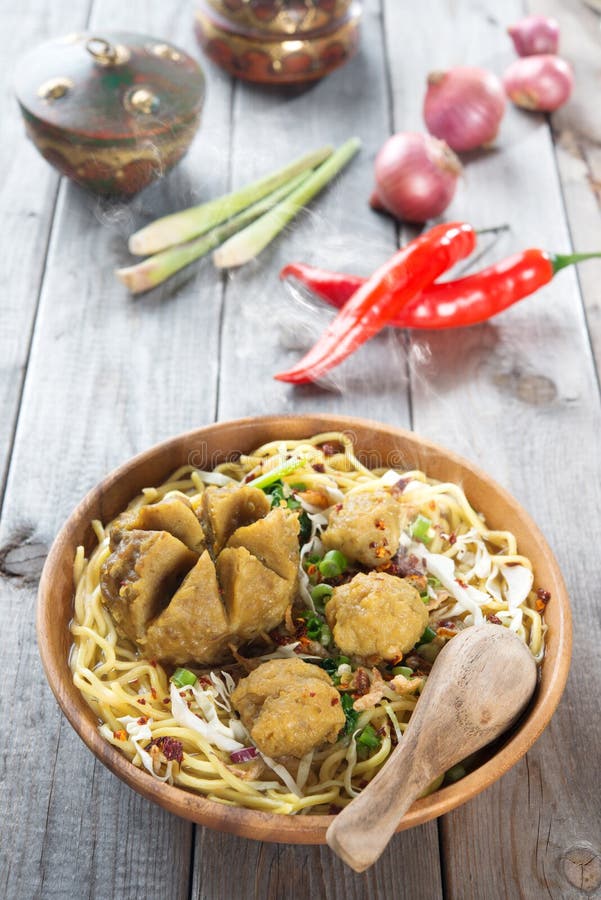 Mee bakso. Bakso or baso is Indonesian meatball made from beef surimi. Popular local food in Indonesia. Fresh hot with steam smoke.