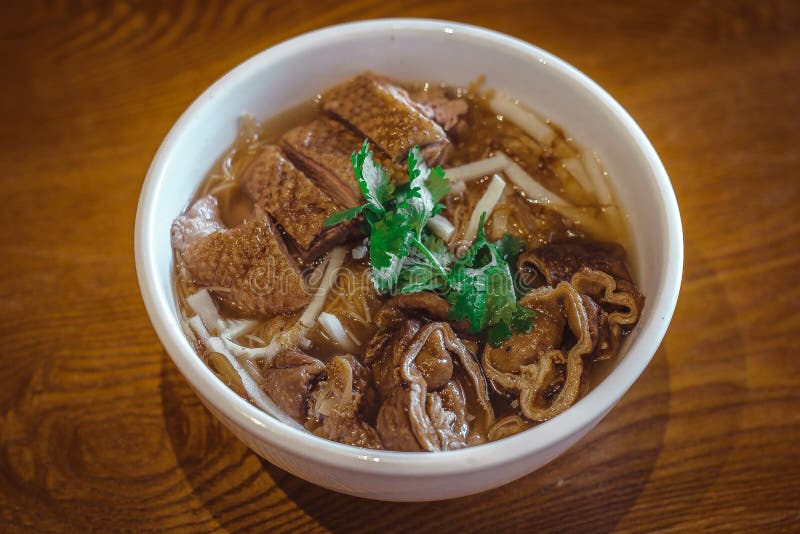 Mee Sua Rice vermicelli with Stewed Duck and Stewed Pig Intestine. In a white bowl