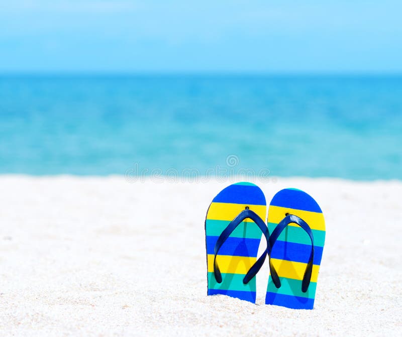 Flip flops on tropical beach. Flip flops on tropical beach.