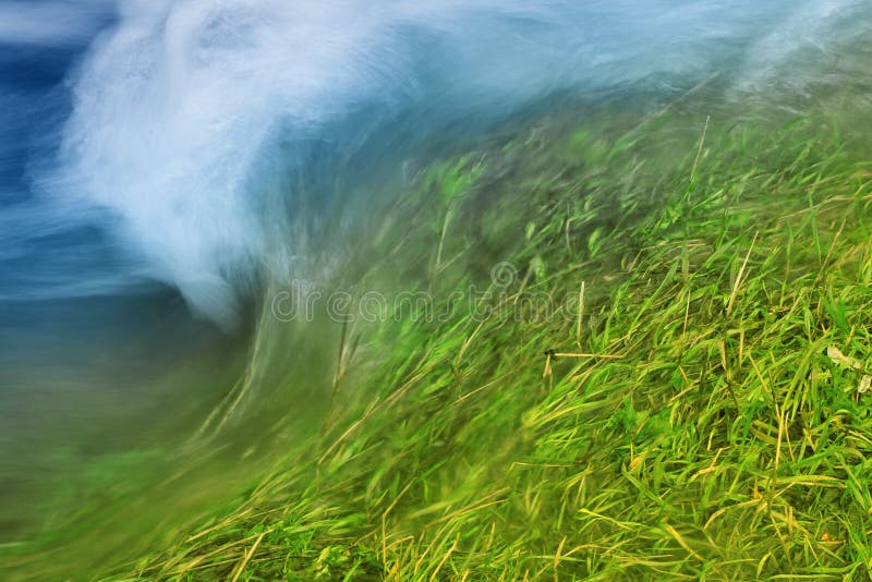 Rushing water over a flooded river bank. Rushing water over a flooded river bank.