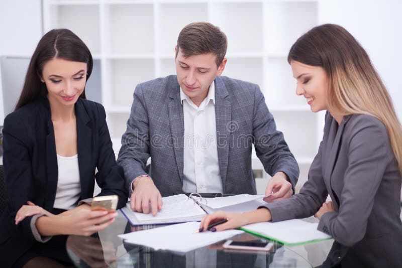 Meeting with agent in office, buying renting apartment or house, buyers of real estate ready to conclude a deal, family couple sh stock photo Meeting with agent in office, buying renting apartment or house, buyers of real estate ready to conclude a deal, family couple sh stock photo