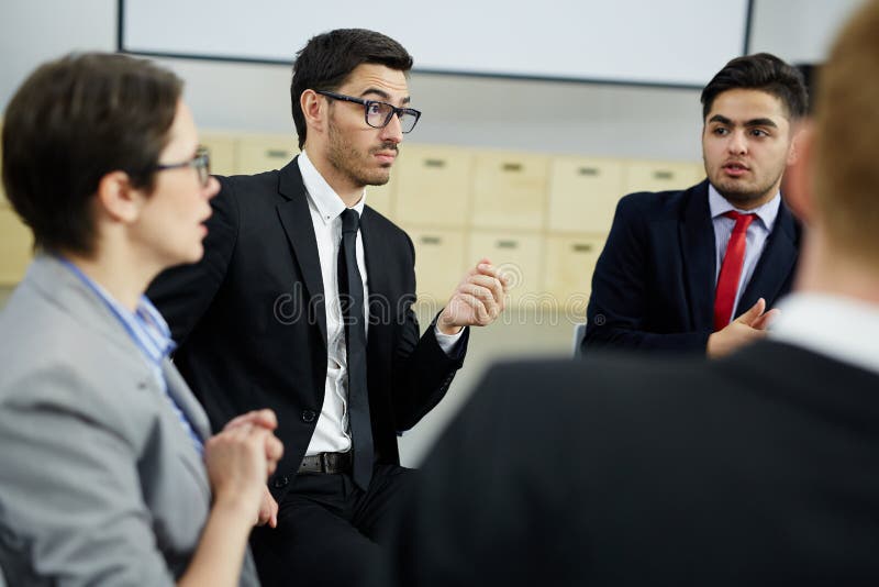 Group of Brokers Listening To Mature Businessman on Large Display Stock ...