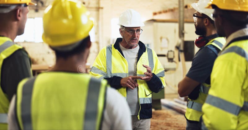 Meeting, contractor and construction team on site for planning with building, maintenance or repair. Discussion royalty free stock photography