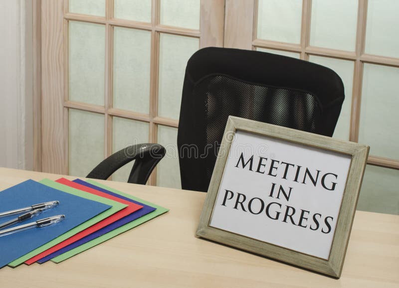 Meeting in progress sign