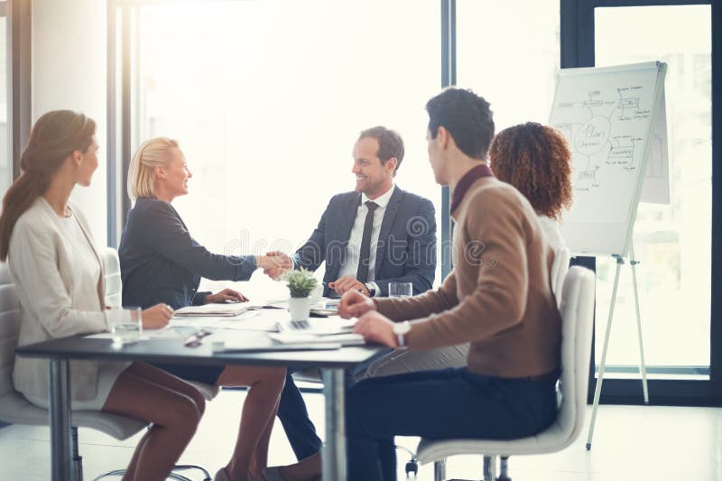 Meeting, shaking hands and group of business people at presentation for b2b negotiation planning. Workshop stock photography