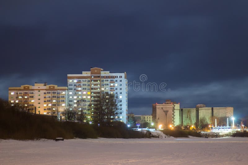 Multi-storey building on the waterfront at night vologda russia. Multi-storey building on the waterfront at night vologda russia