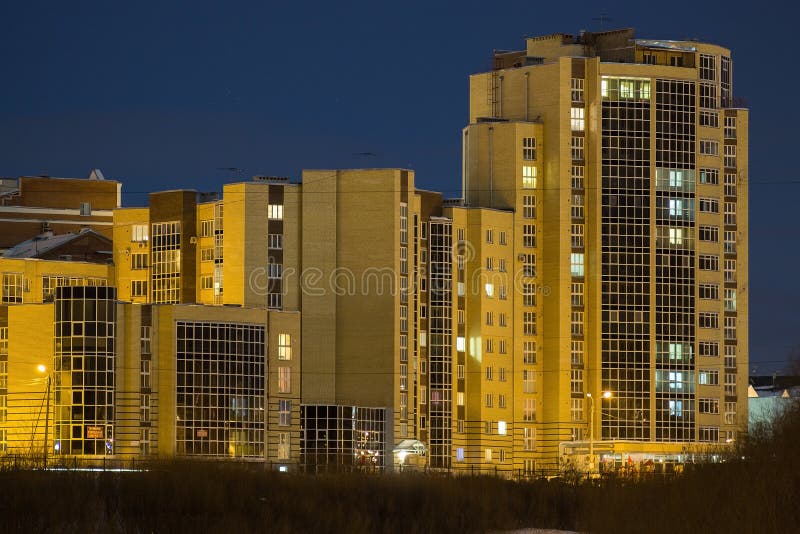 Multi-storey building on the waterfront at night vologda russia. Multi-storey building on the waterfront at night vologda russia