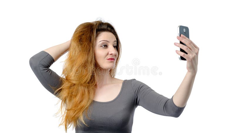 Meisje die fotograferen op een smartphone op wit stock foto's Meisje die fotograferen op een smartphone op wit stock foto's