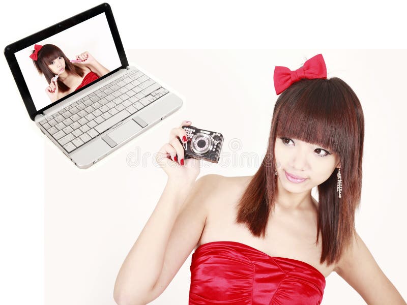 Meisje met een digitale camera stock afbeelding