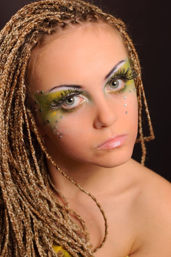 Meisje met opvallende, exotische make-up stock foto