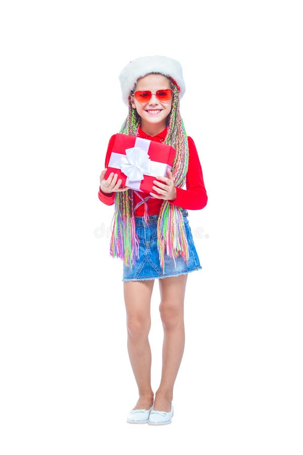 Portrait of little cute girl holding box of Christmas present, Small girl hug her gift with happy and fun expression isolated on white background. Holiday gift. Portrait of little cute girl holding box of Christmas present, Small girl hug her gift with happy and fun expression isolated on white background. Holiday gift.