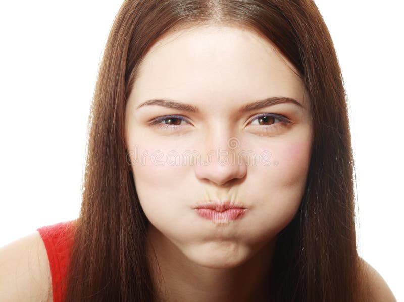 Portrait of disgusted young woman blowing cheeks.White Background,. Portrait of disgusted young woman blowing cheeks.White Background,