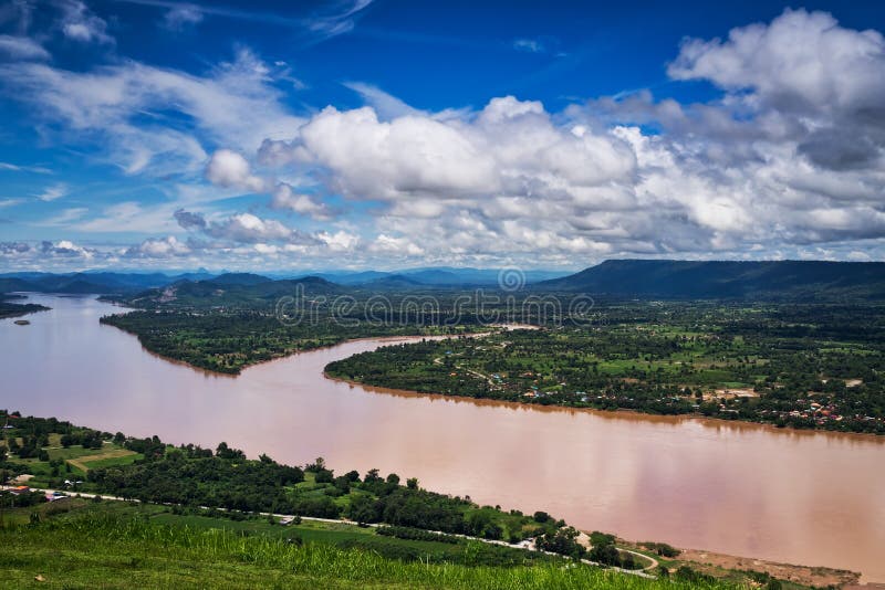 Mekong River At Nong Khai In Thailand, high angle view of landscape with cumulus clouds