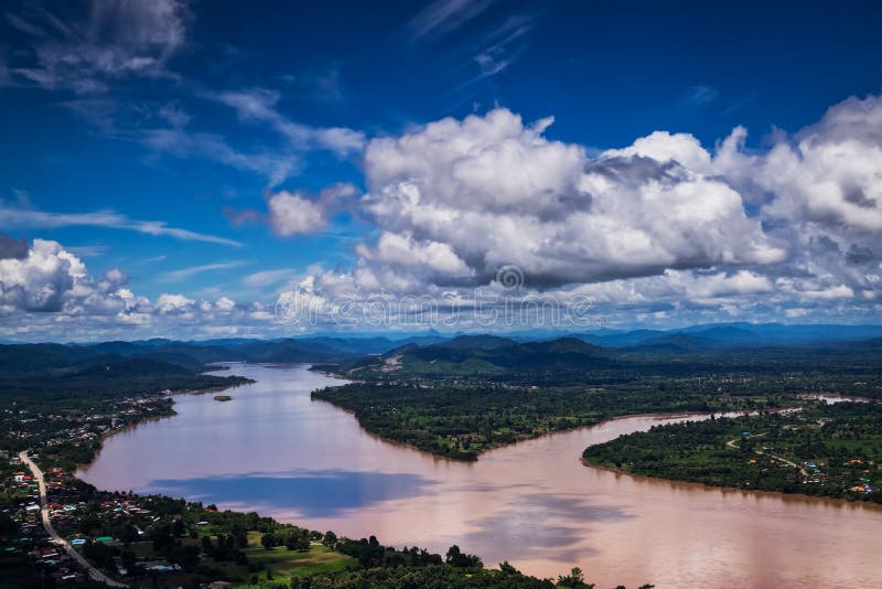 Mekong River At Nong Khai In Thailand, high angle view of landscape with cumulus clouds