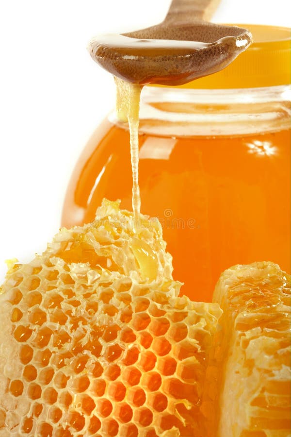 Honeycomb with natural honey on a white background. Honeycomb with natural honey on a white background
