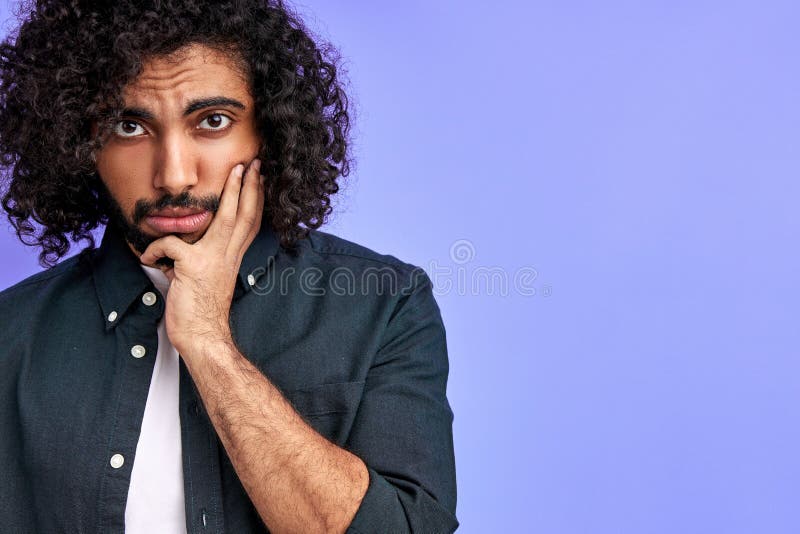 Melancholy Arabic Man with Curly Hair Look at Camera with Sadness Stock  Photo - Image of eastern, beard: 207139712