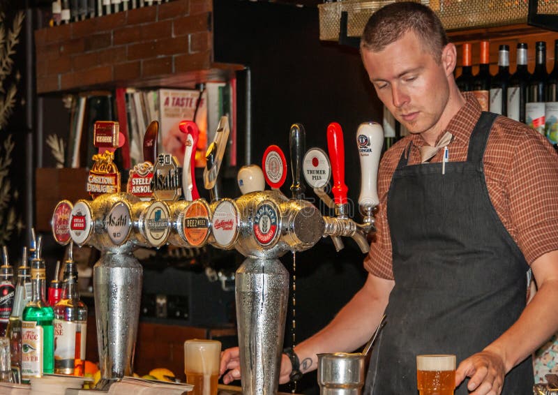 Closeup of Barman Tapping Beer at Cookie Restaurant and Bar in ...