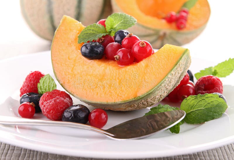 Melon and berries fruits stock image. Image of currant 24527291