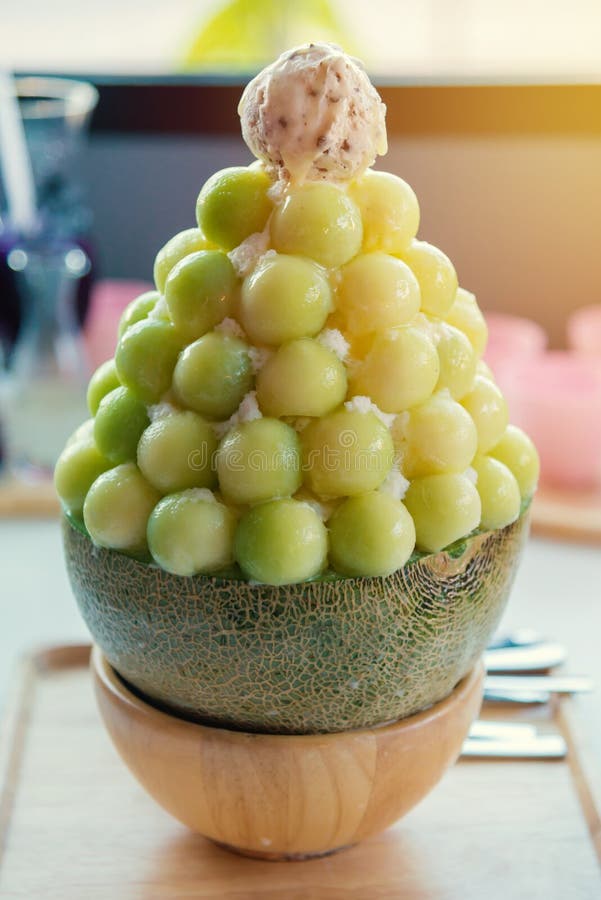 Melon Fruit with Sweetened Condensed Milk on Ice Cream Stock Photo