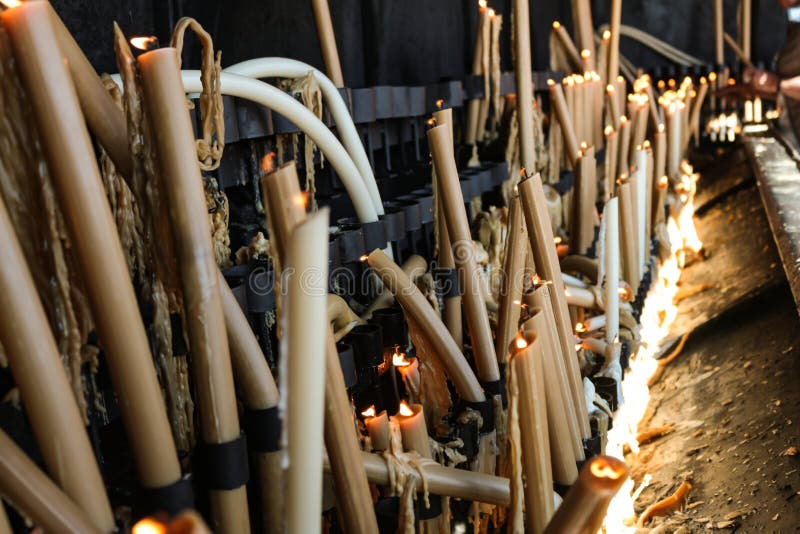 Melted candles in the city of Fatima Portugal. Candles lit as a sign of Christian faith stock images Melted candles in the city of Fatima Portugal. Candles lit as a sign of Christian faith stock images