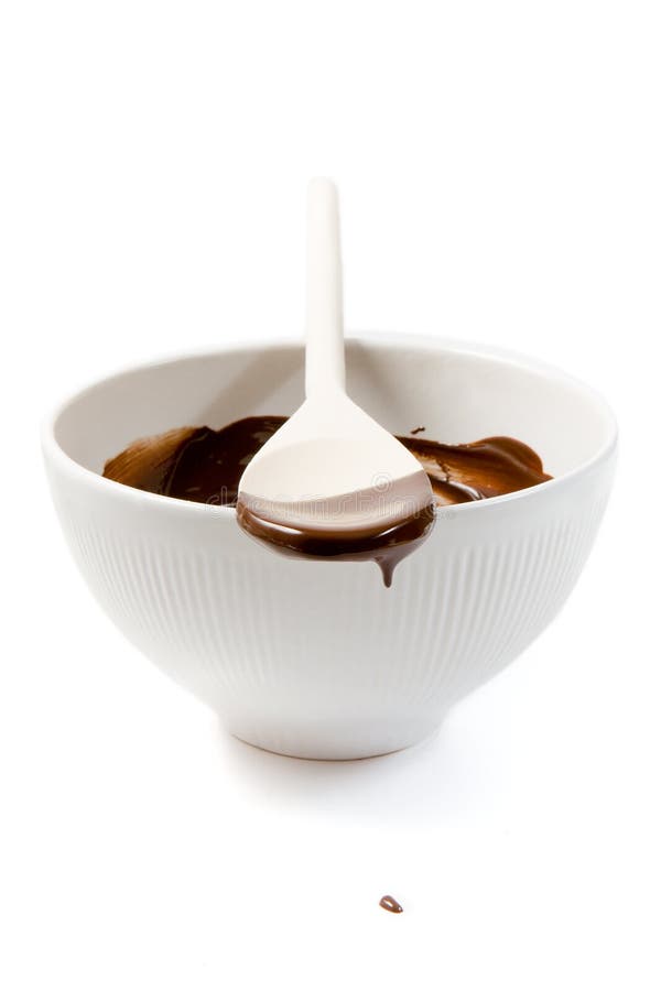Melted dark chocolate dripping from the spoon stock photography Melted dark chocolate dripping from the spoon stock photography