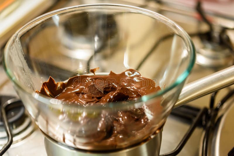 Melting Chocolate on Stove stock photo. Image of dark 84734214
