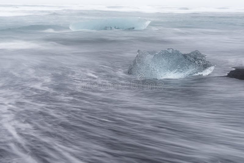 Floating Ice on Jokulsarlon Glacier Lake in Ultraviolet at Sunrise
