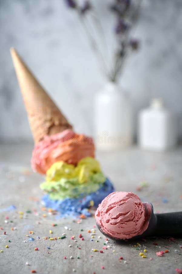 Close Up Rainbow Ice Cream Cone Stand in Glass on Marble Background