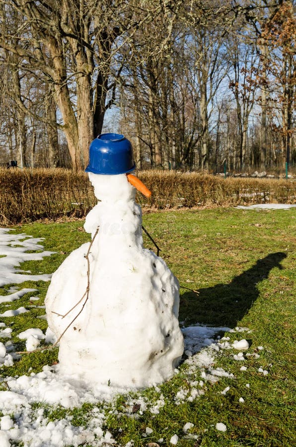 A melting snowman - Impossible Images - Unique stock images for commercial  use.