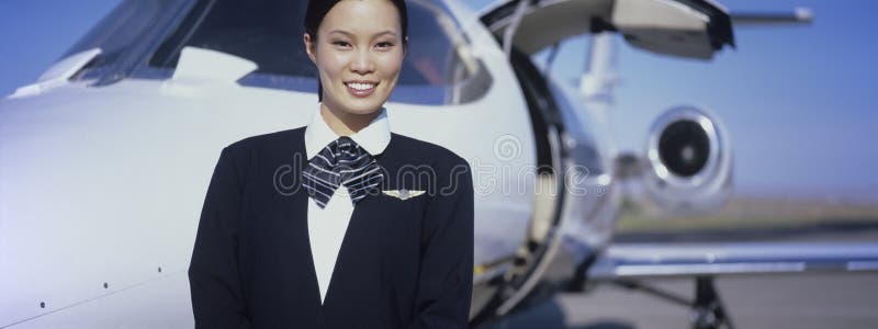 Member Of Flight Crew Standing By Airplane stock image