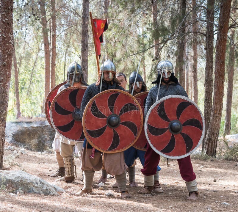 Members of the annual reconstruction of the life of the Vikings - `Viking Village` demonstrate combat formation in the forest near